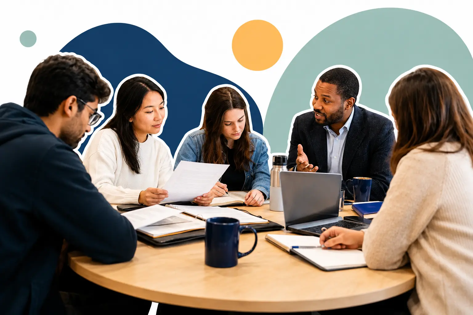 Career adviser guiding a diverse group of graduates around a laptop and application documents